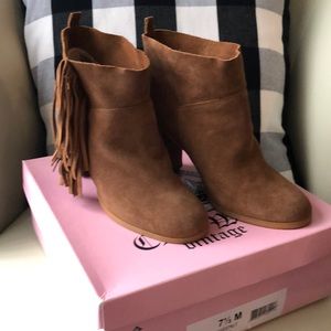 Super cute ankle booties with fringe on sides.